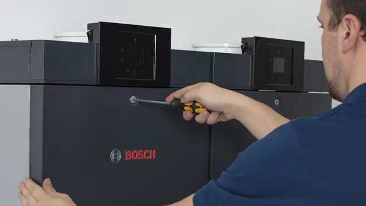 Engineer working on 700WP commercial boiler