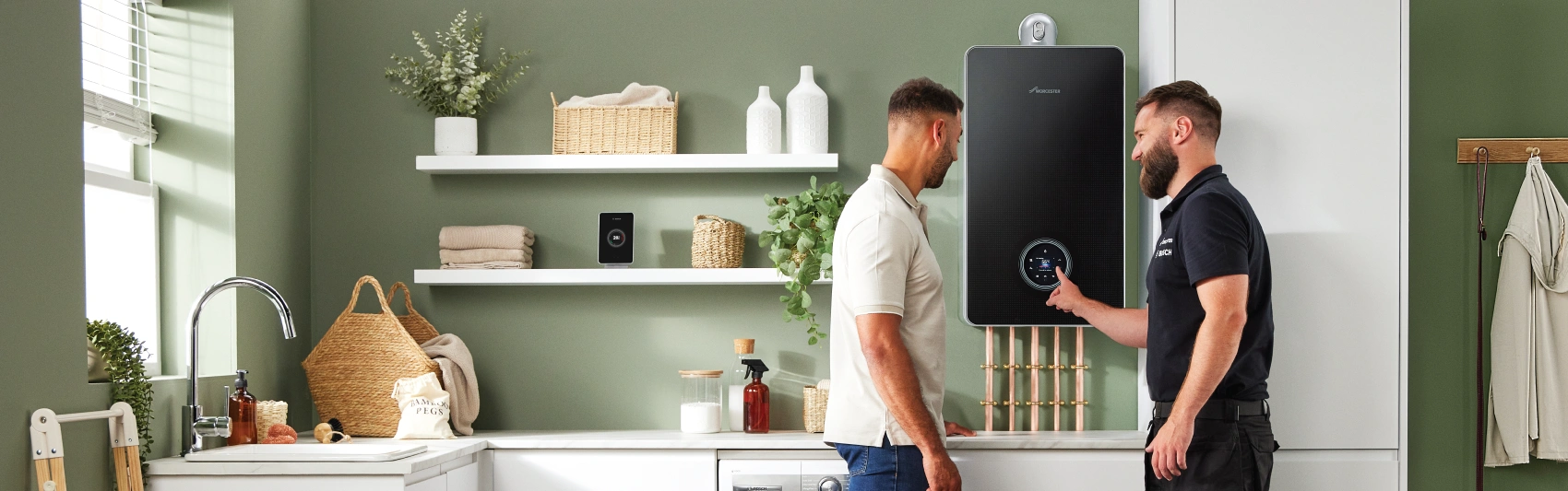 Installer and homeowner with boiler