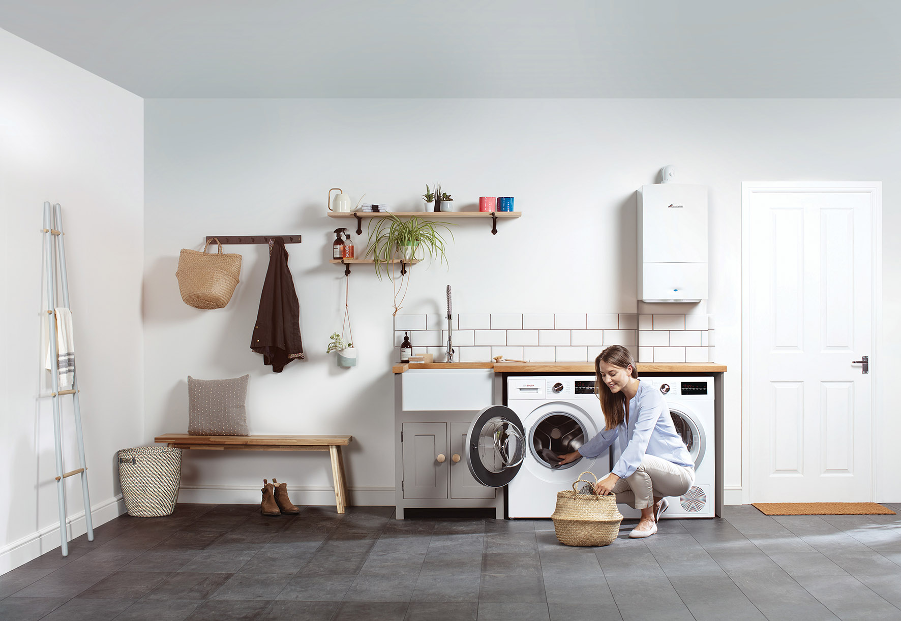 Woman checking her washing machine is working