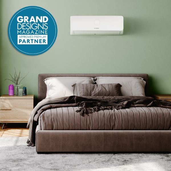 climate 3200i air con unit on the wall in bedroom with grand designs partner logo