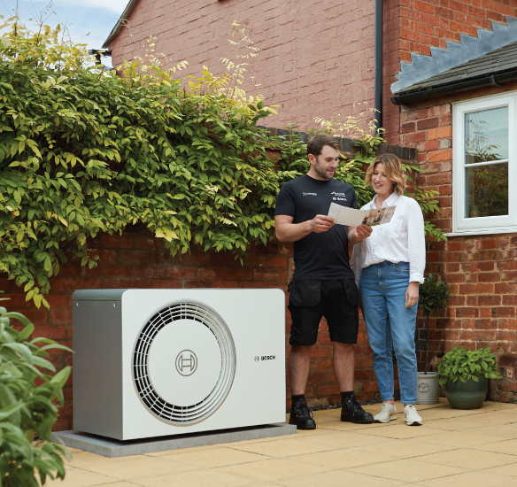 installer and homeowner outside with 5800 heat pump