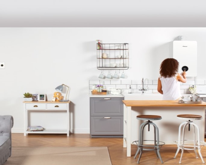 Woman turning on her boiler