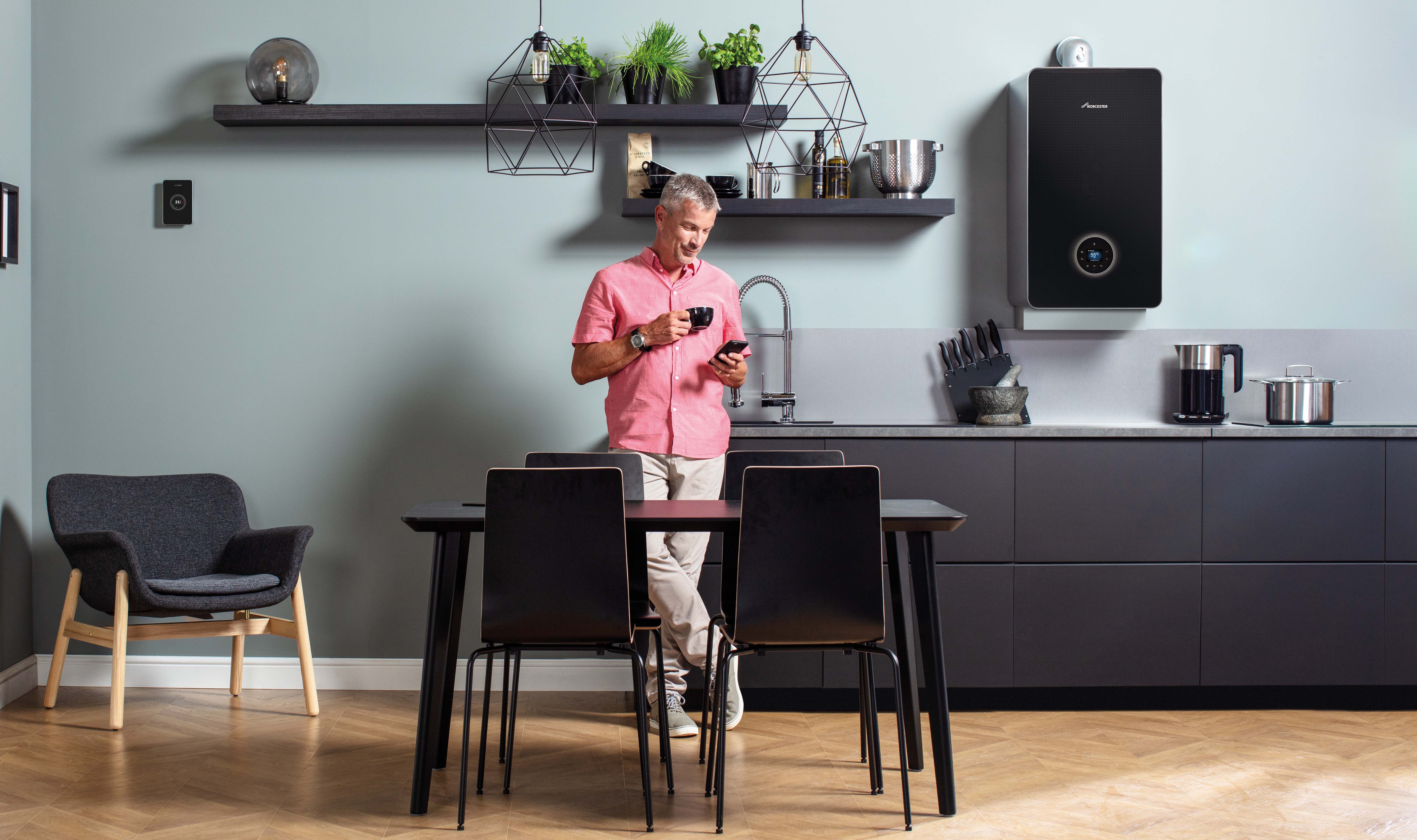 man drinking a hot drink on a cool day