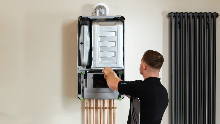 Engineer fixing a broken boiler