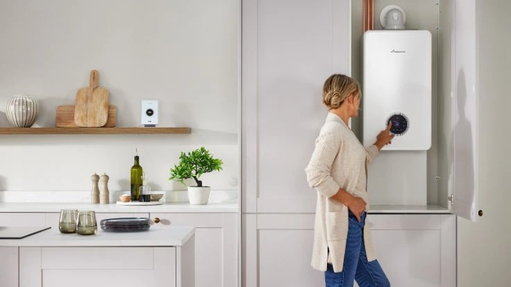 Women in front of Greenstar 4000 boiler