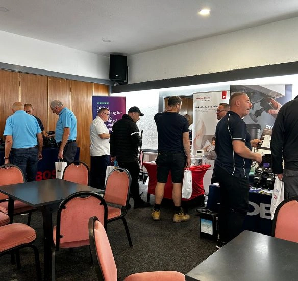 overview of installers walking around the stands at the roadshow