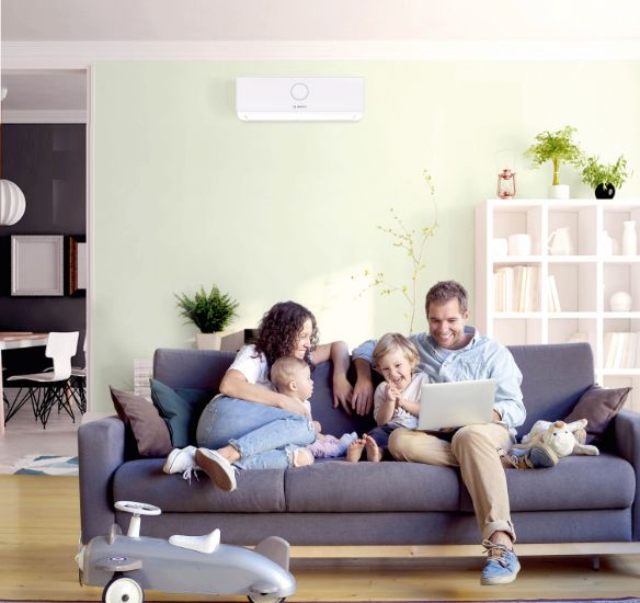 Family on sofa with Climate 5000i on wall