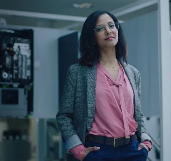 Tahsina Khan standing in front of boilers