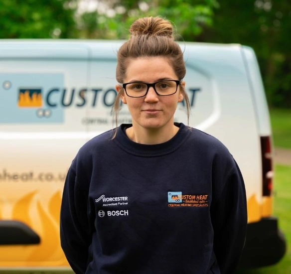Bethany Jenkins standing in front of Custom Heat van