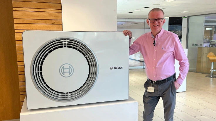 Martyn Bridges standing next to Compress 5800i