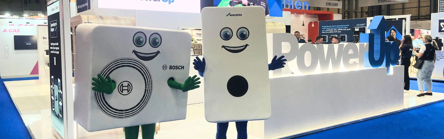 Bobby the boiler and Harley the heatpump mascots at the Installer Show