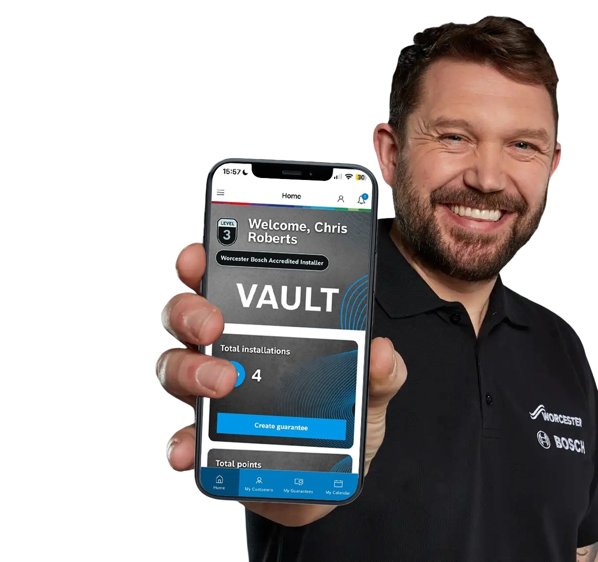 Installer holding phone with VAULT dashboard on screen
