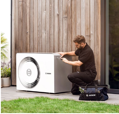 Homeowner with dog and boiler