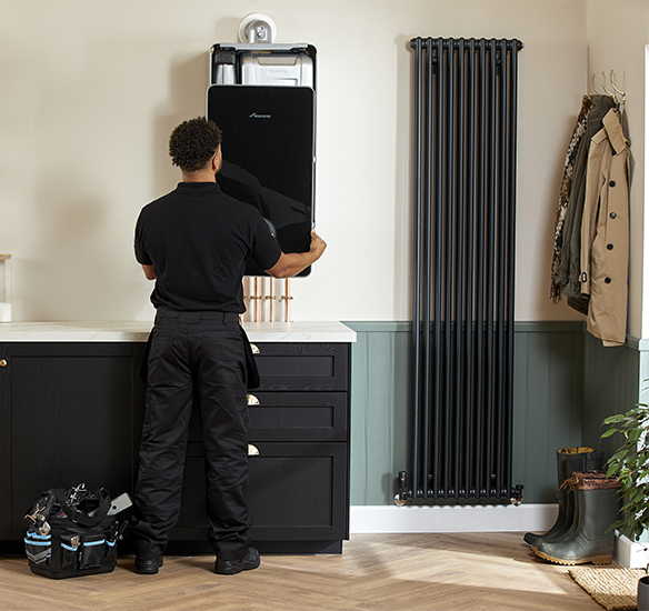 Installer removing boiler