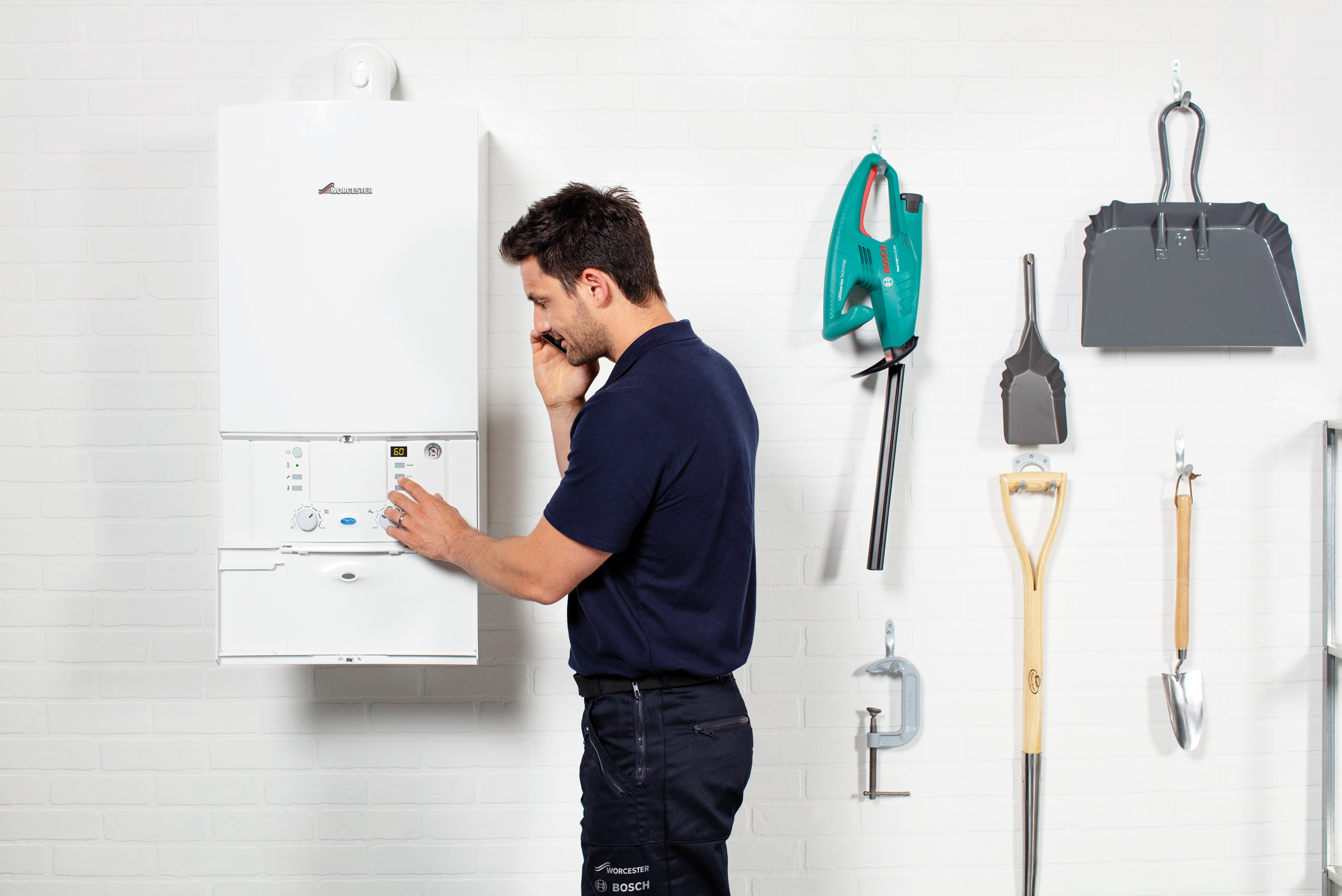 Installer checking boiler